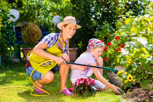 Technician assisting a homeowner in a garden setting to illustrate on-site accessibility adjustments