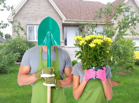 Workers wearing PPE while maintaining a garden