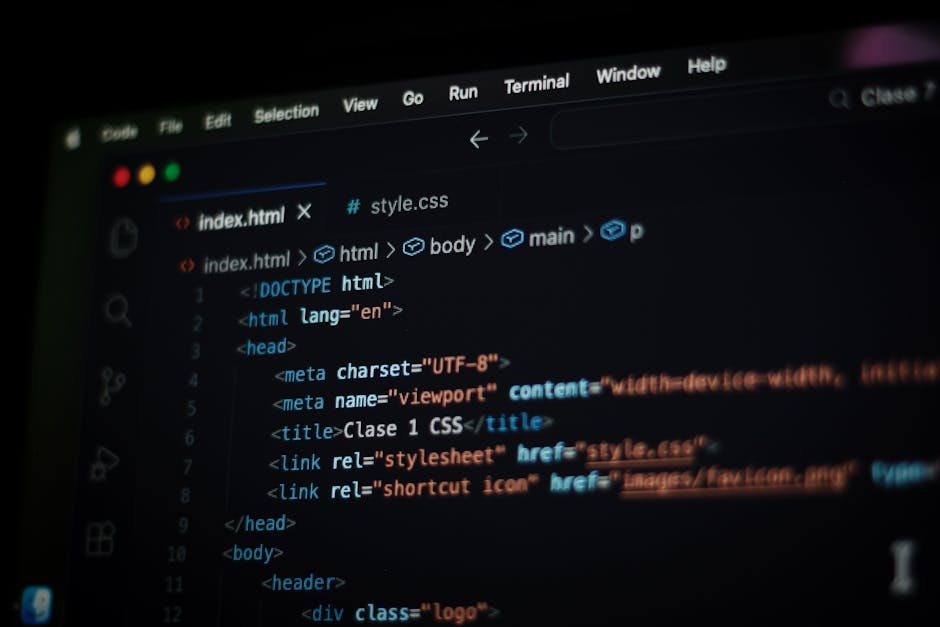 A computer screen displaying an open code editor with HTML and CSS code visible. The code includes tags such as <html>, <head>, <meta>, and <title>, with syntax highlighting in blue, orange, and white